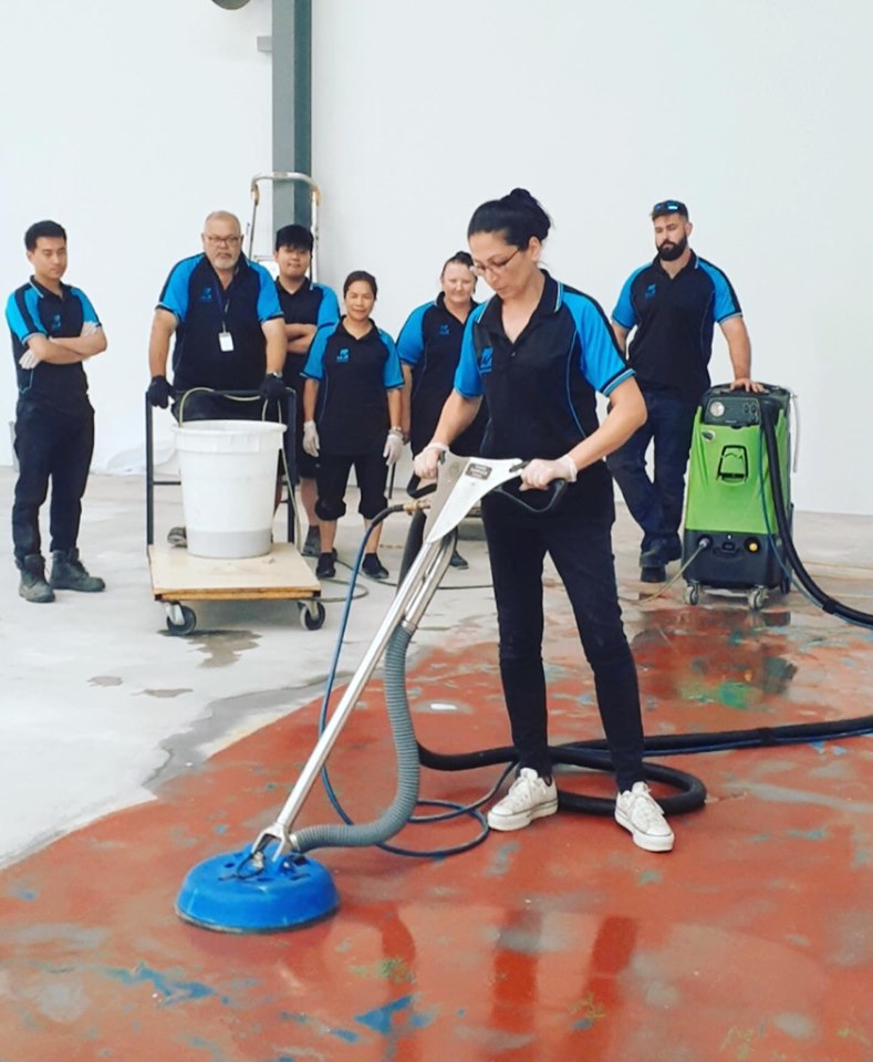 Team members at a floor-cleaning training session